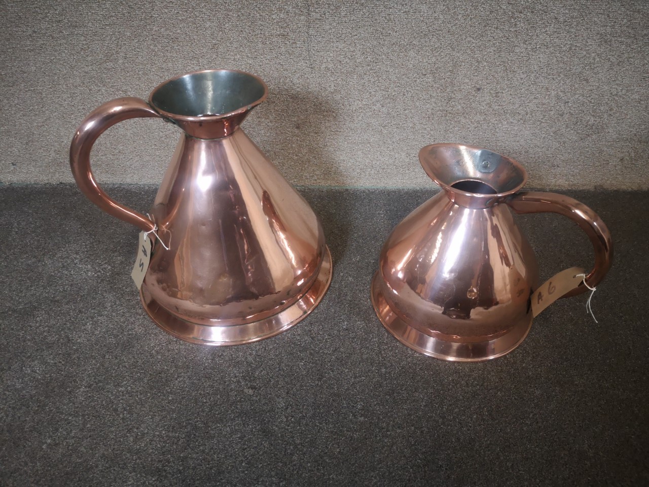Two large copper jugs画像