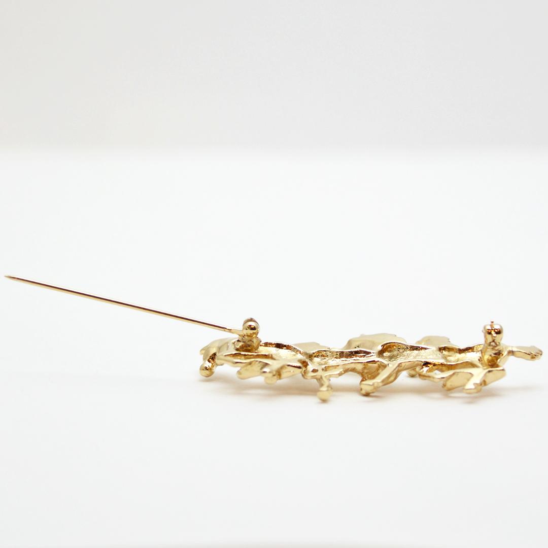 ヴィンテージ ホースハード メタルブローチの画像