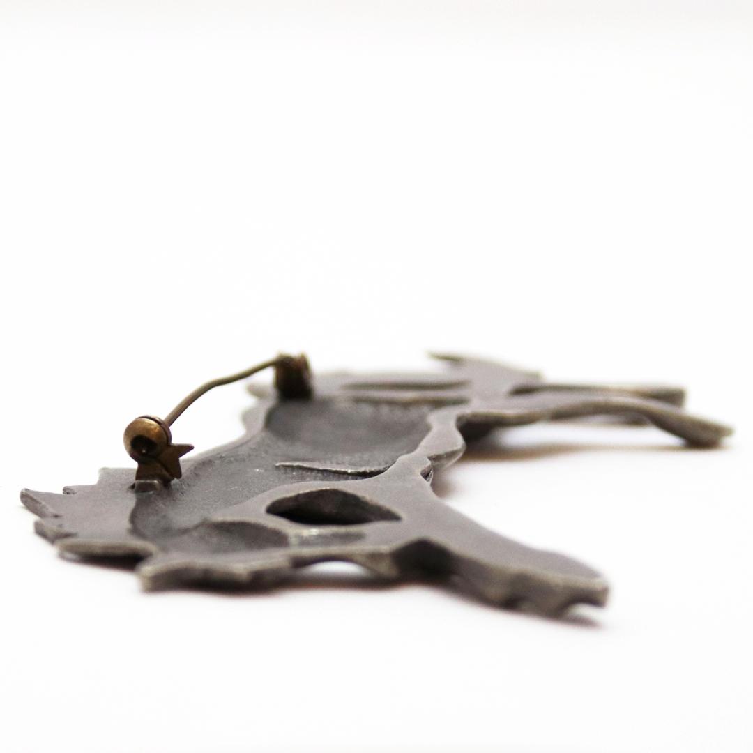 ヴィンテージ ピューター リーピングホースブローチの画像