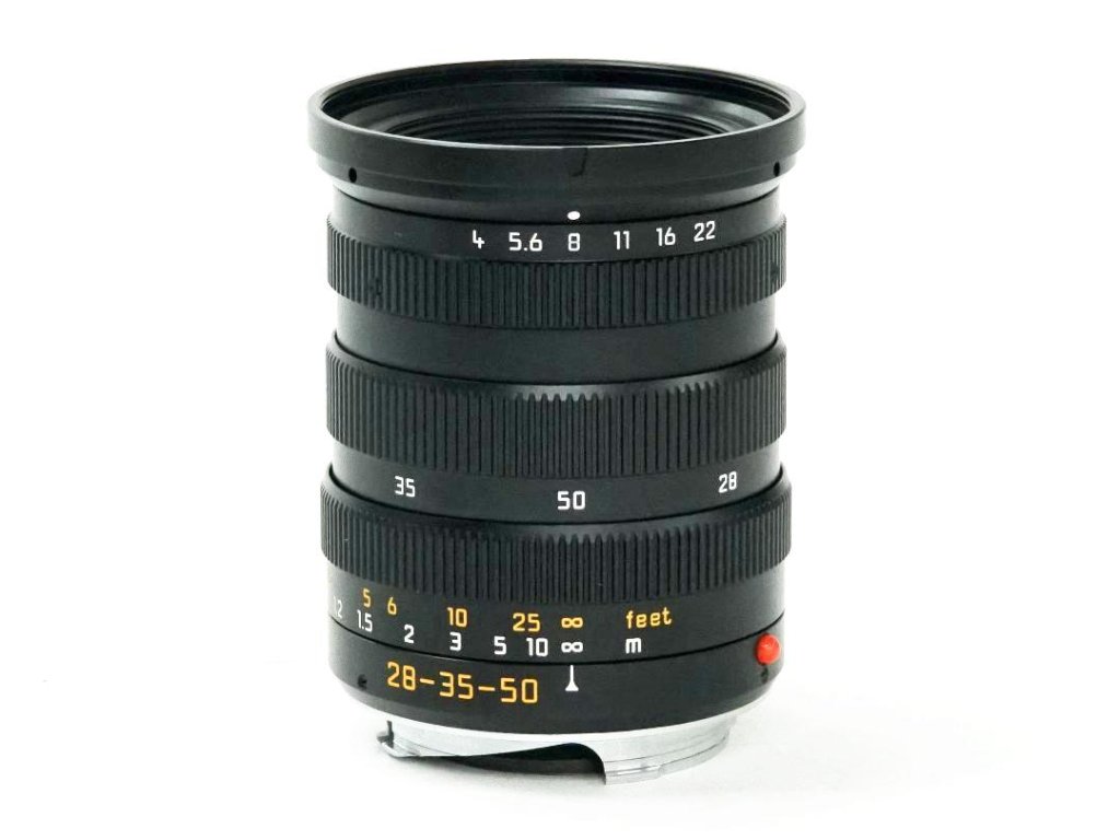 28-35-50mm/f4 Tri-Elmar ASPH (E55) Germany ライカM用 純正 前後レンズキャップ、 レンズケース、Garantie Card、 元箱付 距離計連動　新品同様の画像